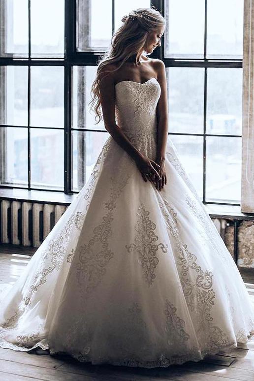 princess strapless ball gown wedding dress with appliques