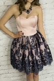 sweetheart blush satin homecoming dress with navy appliques